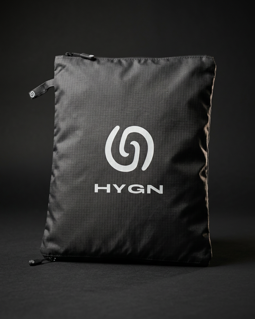 HYGN antimicrobial gym bag, closed, showing the spiral logo on 420D nylon
